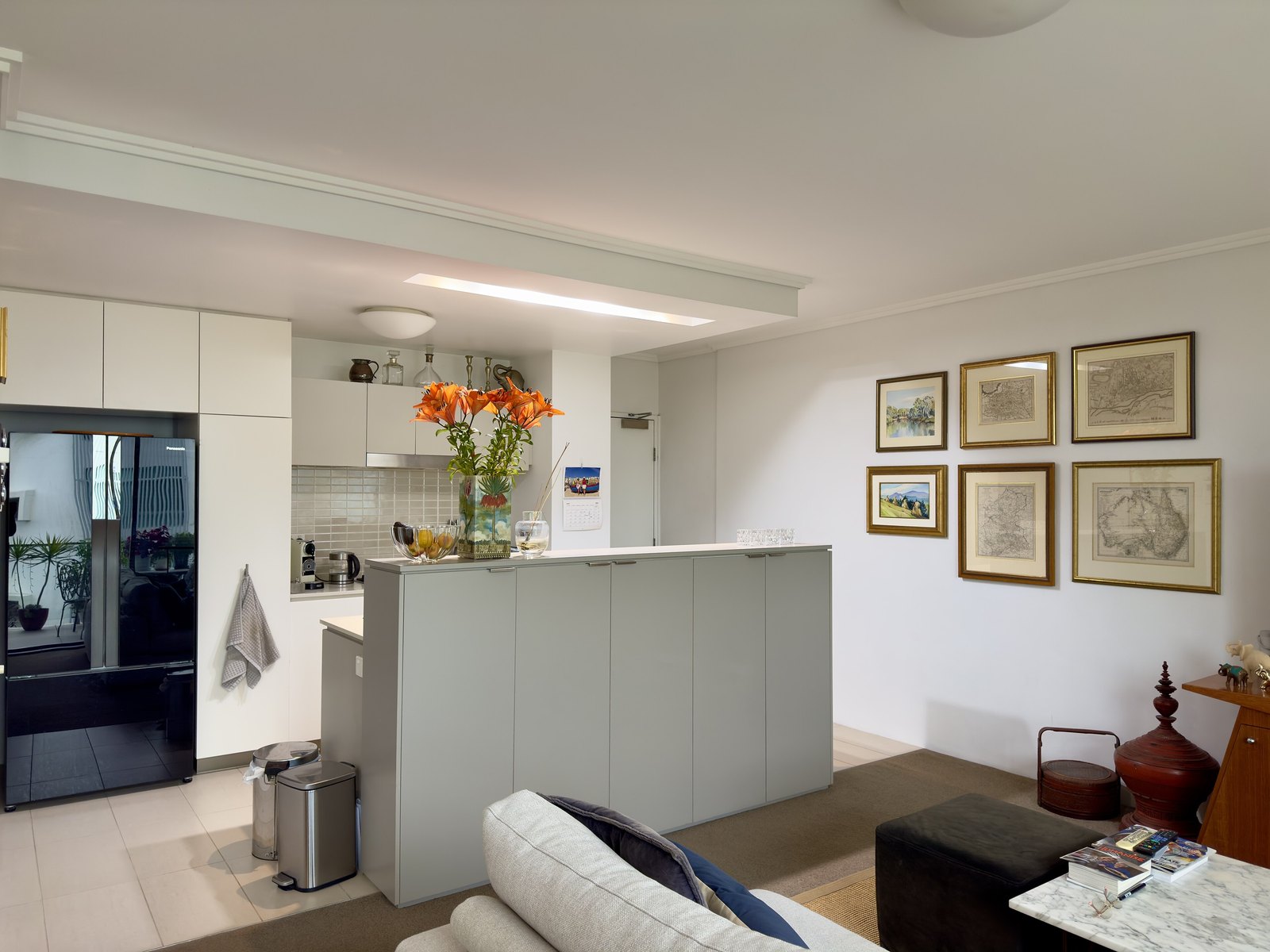 Open-plan furnished apartment living room and kitchen
