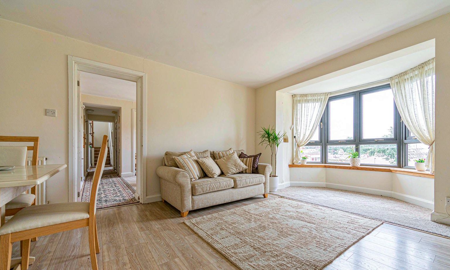 Furnished stay interior with sofa and natural light